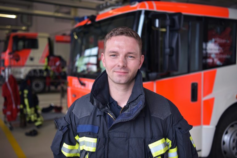 portrait of a firefighter in the operations centre at the fire-fighting vehicle